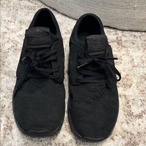 Black Nike Stefan Janoski Sneakers with Knit Upper and Rubber Sole